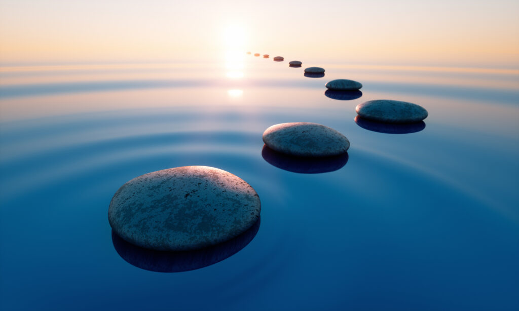 Row of stones in calm water